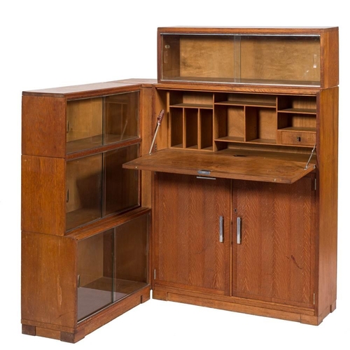 302 - A 'Minty' oak corner bookcase:, with a three section, having glazed (sliding) doors, 71cm wide, 111c... 