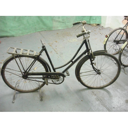 712 - A Raleigh all steel bicycle: step through frame with plated handlebars, bar brakes, single speed cra... 