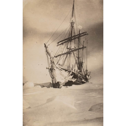 72 - A group of three photographs of an ice locked Terra Nova:, together with a postcard of the Terra Nov... 