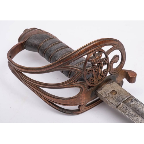 242 - A Victorian officers sword,: with 80cm etched and fullered blade, triple bar knuckle guard, with fis... 
