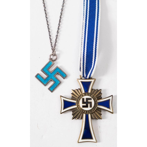 250 - A Reproduction Cross of Honour of the German Mother, together with a silver and enamel swastika: (2)
