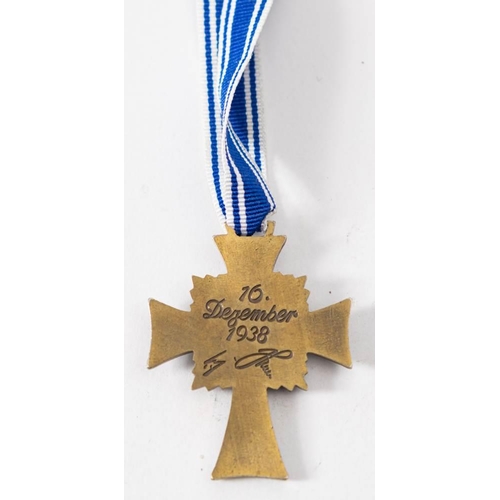 250 - A Reproduction Cross of Honour of the German Mother, together with a silver and enamel swastika: (2)