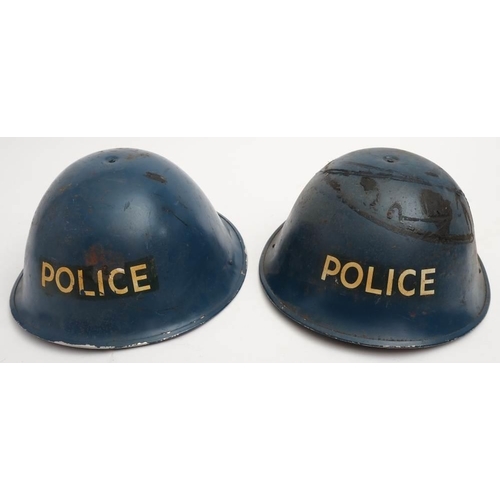 274 - Two post War Police Mk III 'turtle' steel helmets: blue with transfer to front, both with original l... 