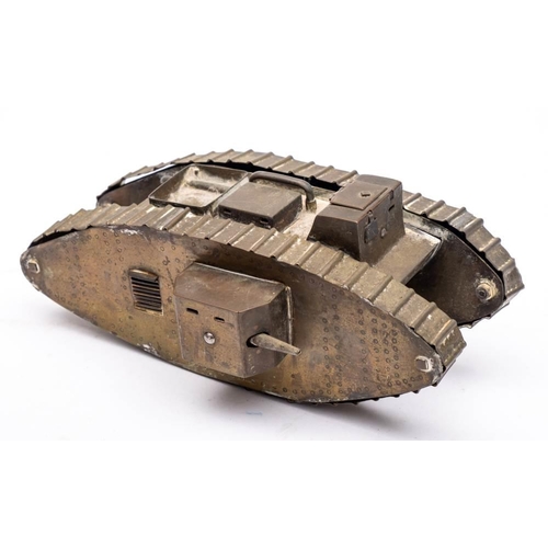 290 - A WWI Trench art model of a tank: with box turret and exhausts to top, (missing one side gun) 23.5cm