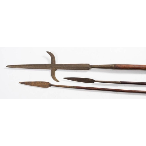 294 - An antique pole arm: the cruciform blade with inverted crosspiece on a pine shaft,210cm long, togeth... 