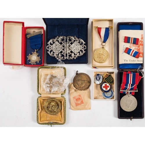 296 - A WWII War Medal together with a collection of enamel badges etc. : including  Girl Guides, Red Cros... 