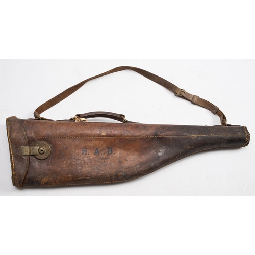 59 - An early 20th century leather leg o' mutton gun case: initialed HAB' together with a leather gun cas... 