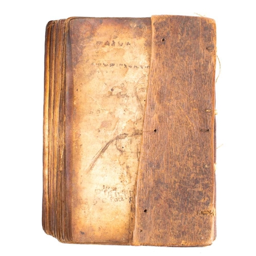 373 - HOLY BOOK : hand written in a Coptic script, on heavily stained vellum, stitched together in nine ga... 