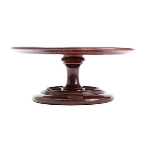 214 - A mahogany Lazy Susan constructed from timber taken from  HMS Britannia: the circular top with mould... 