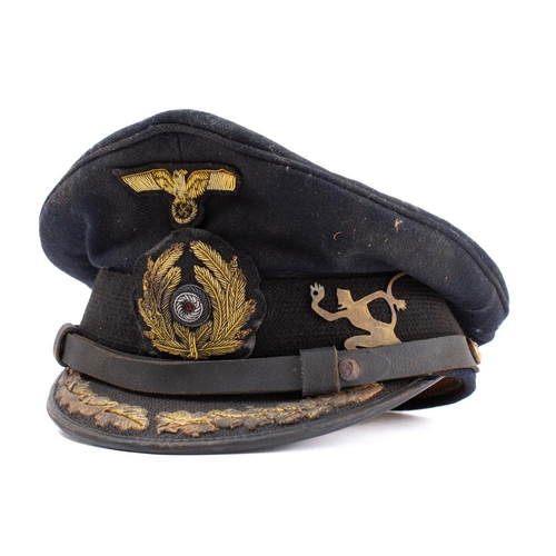 232 - A WWII Kriegsmarine U-Boat Officers peaked cap: the black cloth cap with gilt embroidered badges, br... 