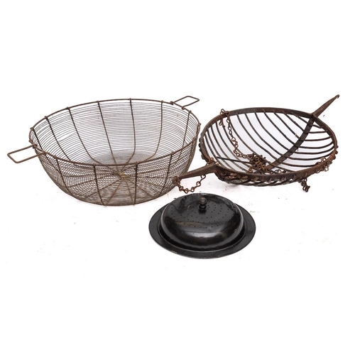 105 - A Continental circular iron twin-handled basket spit: with suspension chains, 41cm diameter, also a ... 