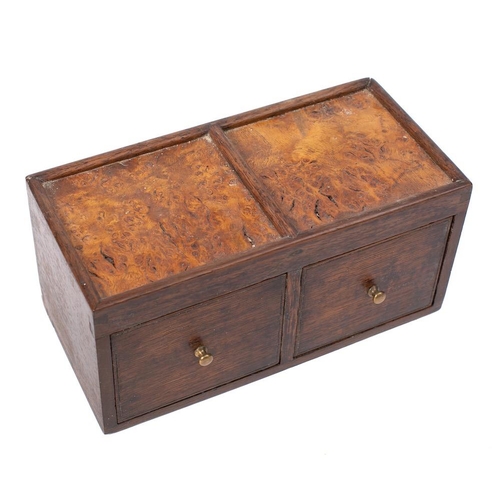 205 - An oak two drawer spice chest: with twin burr inset panel top, 25cm wide.