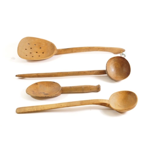 209 - A collection of seven treen ladles: of various designs, a treen skimmer and four other items. (12)