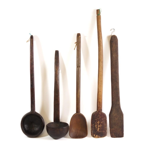 209 - A collection of seven treen ladles: of various designs, a treen skimmer and four other items. (12)