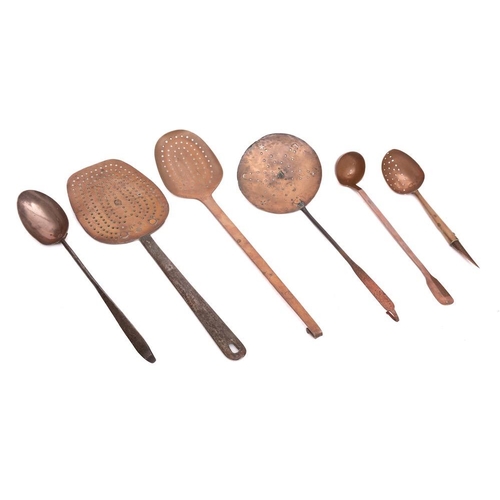 233 - Three copper and metal skimmers:, a copper and metal handled hanging spoon, a copper ladle, the hand... 