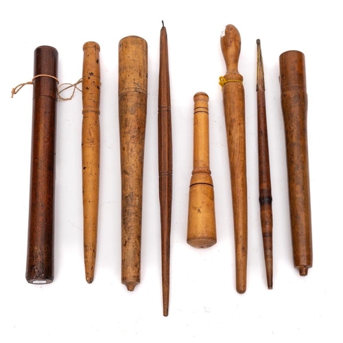 239 - A collection of seven treen fruit spurtles:, also a thermometer in wood holder. (8)