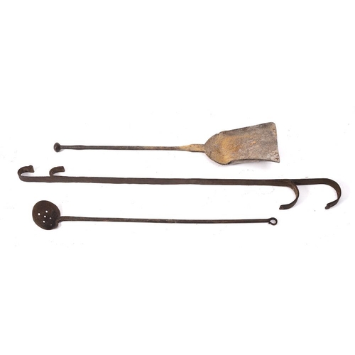 243 - An iron scummer:, an iron shovel and an iron double ended hook, 18th/19th Century. (3)