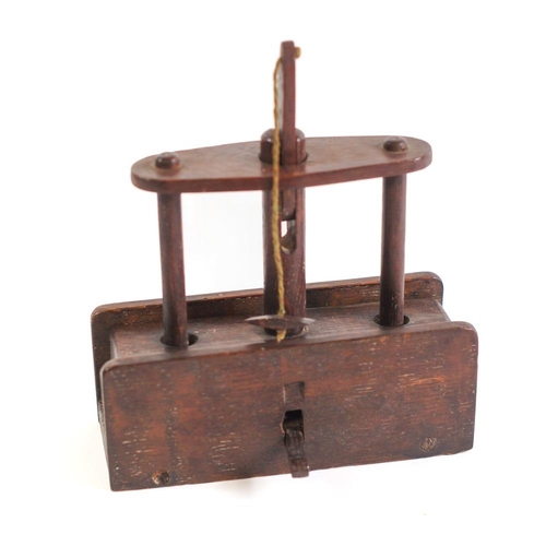 250 - A 19th Century oak drop weight mousetrap:, of rectangular shape with elevating block, 19.5cm long.