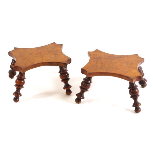 254 - A pair of 19th Century yew-wood stands: in the form of small stools, having shaped burr veneered top... 