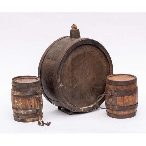 273 - A French oak and iron coopered upright brandy barrel:, the side with initials L.J., 33cm diameter, a... 