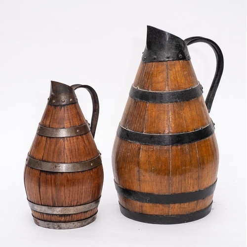 274 - An iron coopered olive oil jug: of pear shape, 39cm high and a smaller olive oil jug, 29cm high. (2)