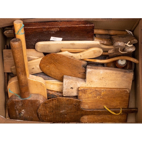 28 - A collection of wood butter pats:, chopping boards, etc.