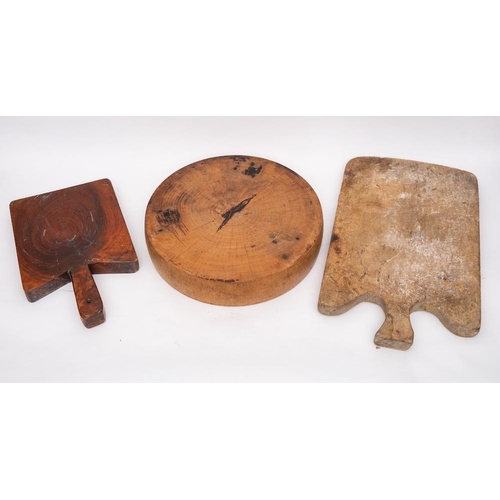 29 - A circular wood weight for a cheese press:, 40cm diameter, also two wooden chopping boards. (3)