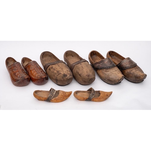 294 - Four pairs of Pyrenean wooden wedding clogs: of varying styles.