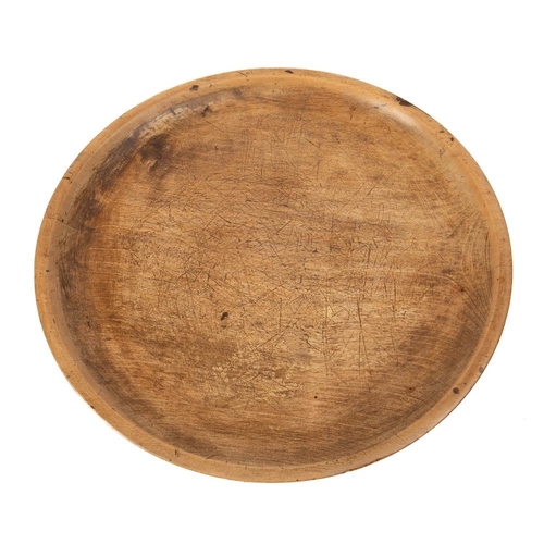 300 - A circular sycamore tray or platter:, 44cm diameter, 17th/18th Century.