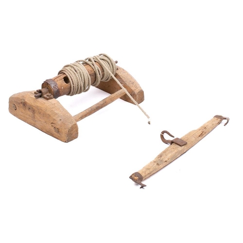 311 - A butcher's pig hoist: with rope attached barrel and separate iron mounted beam, 55cm wide.