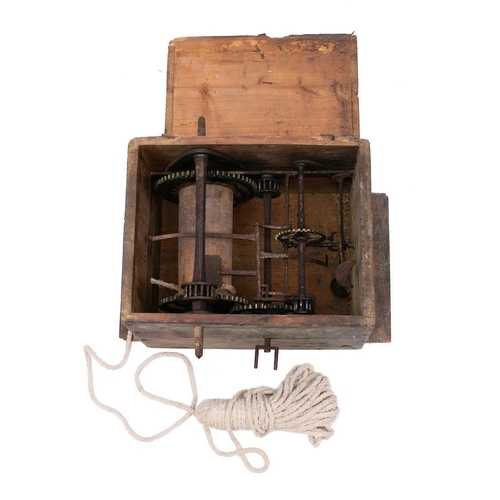 312 - A 19th Century mechanical hoist: contained in a wooden box with cover, the mechanism with three pron... 