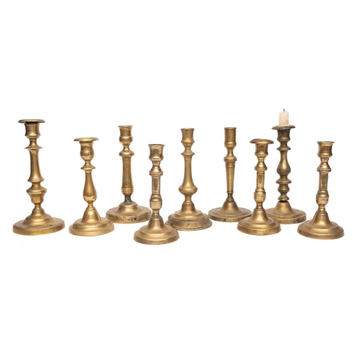 343 - Nine various 19th Century brass candlesticks:.