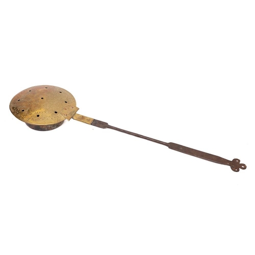 380 - A late 18th/early 19th Century brass and copper chestnut roaster: with iron handle and trefoil termi... 