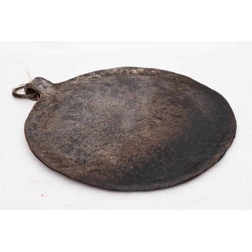 397 - An iron griddle plate or baking iron: with tapered handle, 37cm diameter, another smaller, 21cm diam... 