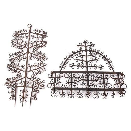 414 - A decorative wrought iron wall mounted rack: of domed outline with five hooks, 52cm high x 59cm wide... 