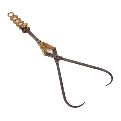 423 - An iron and brass adjustable height patent meat scissor hook: with engraved decoration, 45cm.