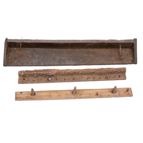 448 - A rustic wooden shelf: with twin nail hooks, 111cm wide, two other rustic wooden bars with hooks, 89... 