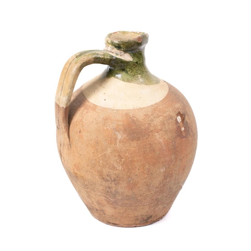 474 - A ribbed terracotta ewer: of oviform shape, 30cm high, a terracotta and slip glazed jar with non-mat... 