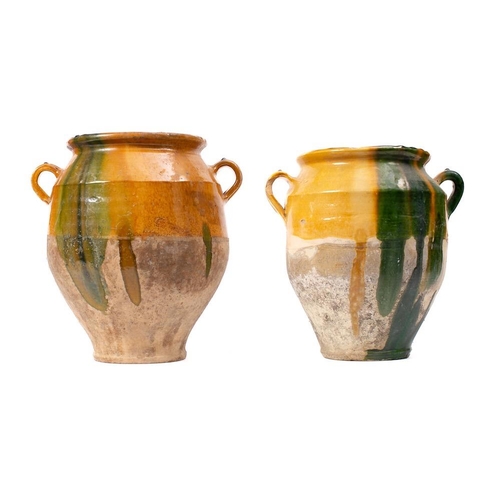 477 - Two French pottery twin-handled comfit jars: with ochre and green slip glazed decoration, 28.5cm and... 