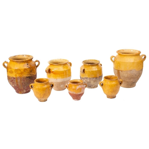 478 - Two French pottery and yellow slip glazed twin-handled comfit jars:, 26cm high, also five other yell... 