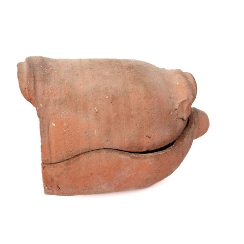 482 - A terracotta salting crock: and twin-handled ribbed cover (for salting ham), 28cm long.