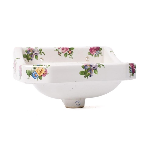 483 - A French pottery wash basin:, printed decoration with sprays of flowers and foliage, 36 x 26cm.