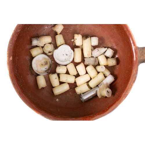 493 - Five graduated terracotta and slip glazed single handled cooking pots: with single lipped bowls.