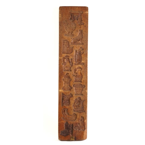 52 - A rectangular fruitwood biscuit mould: with seven bird and animal impressions to one side and fourte... 