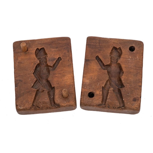 58 - An 18th Century two section chocolate mould: decorated with a figure of a soldier, 10 x 8cm, bearing... 