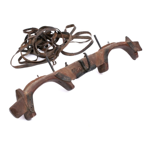 9 - A 19th Century iron mounted wood yoke: with various leather straps, 122cm long.