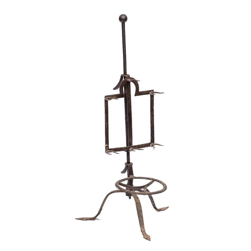 96 - An early 19th Century iron bar-grate lark spit: with six twin prongs mounted on a central pole with ... 