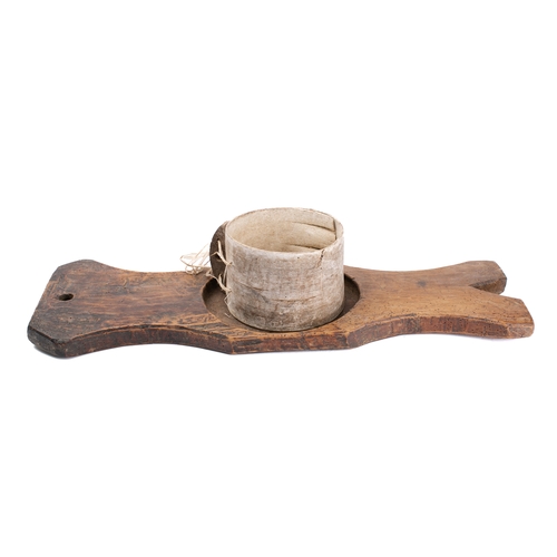 14 - A drum-shaped cheese strainer and press:, the wooden board of shaped outline with circular recess.