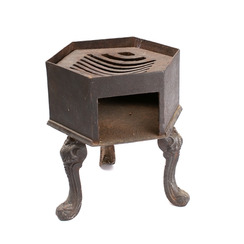 403 - A cast iron hexagonal brazier: with inset grille, on tripod splayed legs, 25cm across, 33cm high.