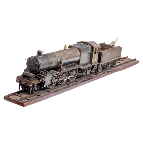 1029 - A large scale (70mm) live steam 2-6-2 locomotive and tender: in a black finish with brass and steel ... 